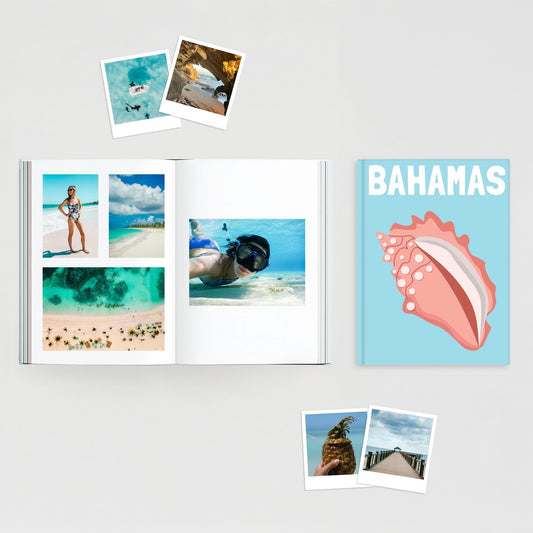 Custom travel photo book for the Bahamas, shown open with vacation photos of beaches and snorkeling, alongside its blue conch shell hardcover.