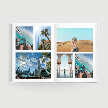 Open custom travel photo book displaying high-quality printed vacation memories from Dubai, featuring desert landscapes and cityscapes.